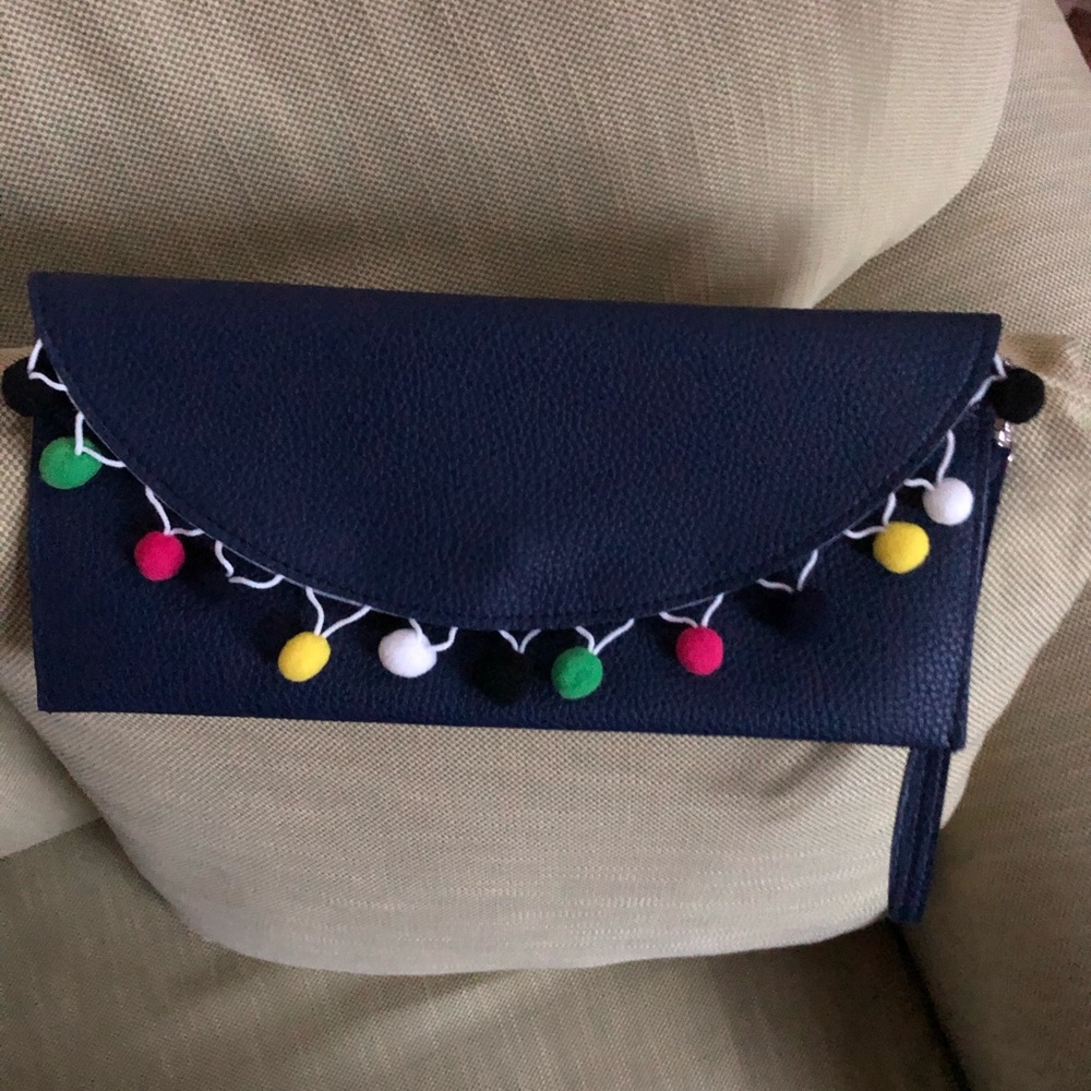Pom Pom clutch bag